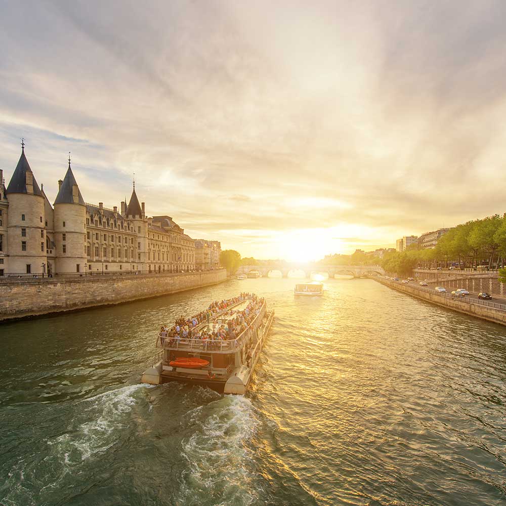 Boat tour on Seine river with sunset in Paris, France<br />
